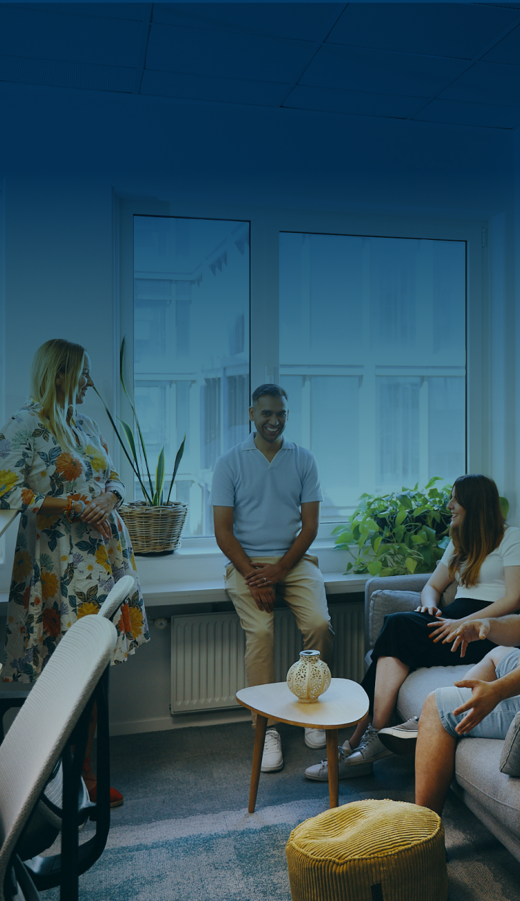 Casual office meeting with team members in modern workspace